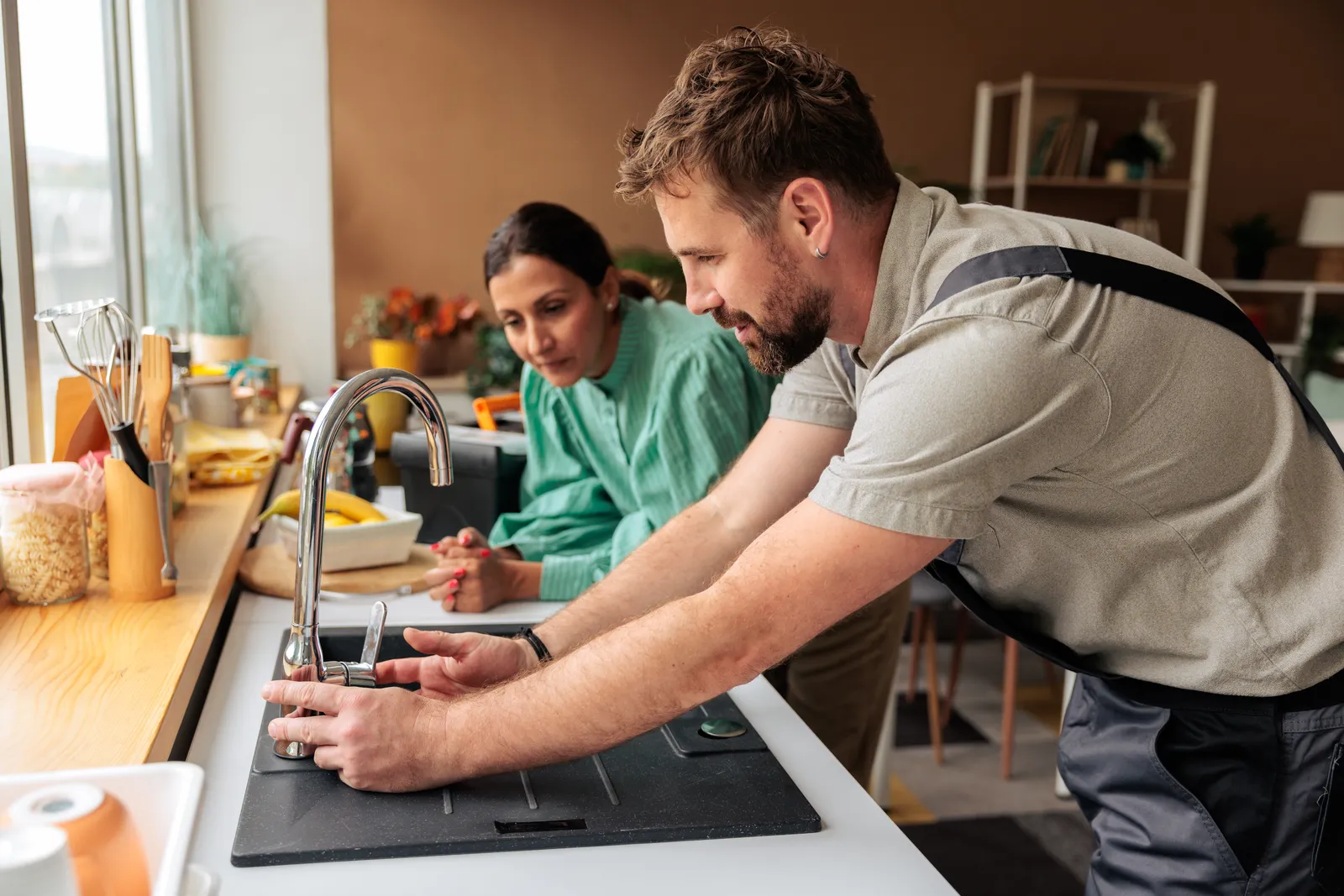 BC Plumbing plumber working with a homeowner